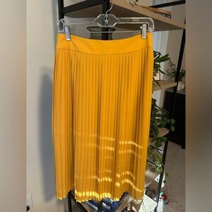 J Crew pleated golden yellow skirt. Size 6. Midi length
